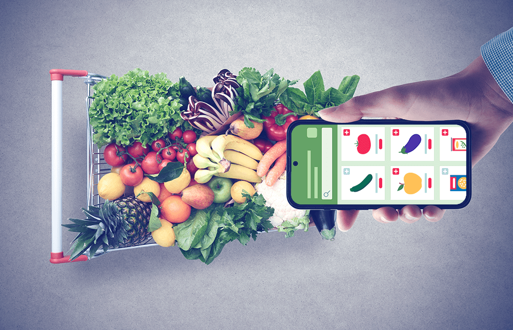 An image of a shopping cart filled with groceries and a mobile phone with ordering functions on it An image of a shopping cart filled with groceries and a mobile phone with ordering functions on it